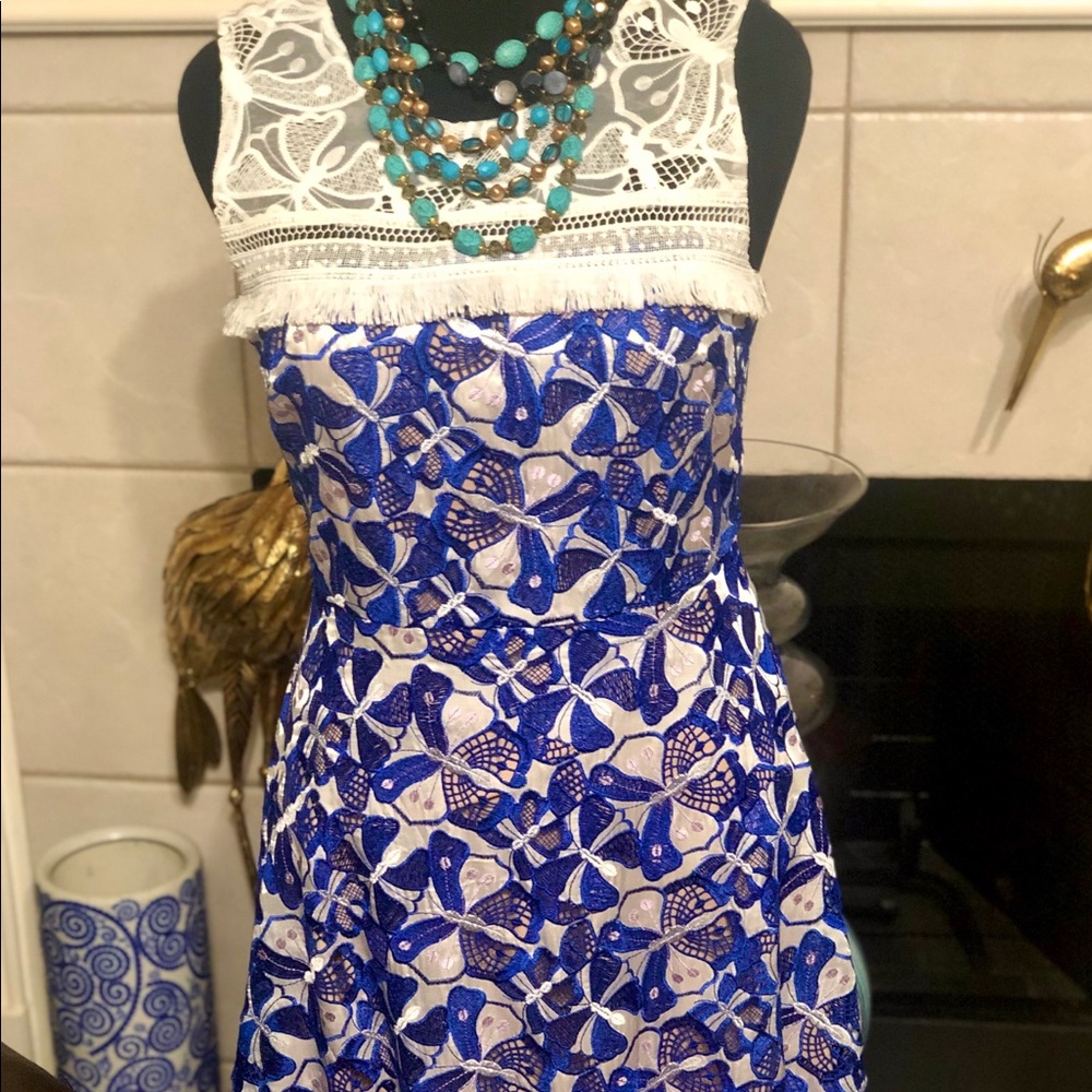 Wow! Who is she in that gorgeous dress?